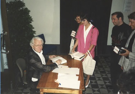 Wolfgang Wagner signing a copy of his book